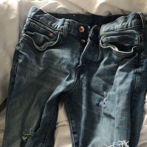 Faded ripped blue wash jeans